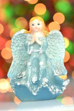Noel süslemesi, Bokeh arka planına karşı mavi melek figürü