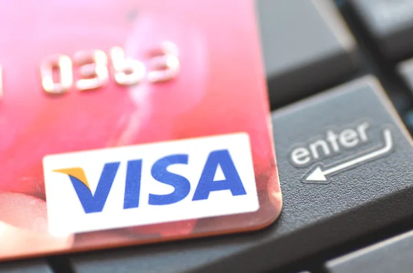 Closeup of VISA credit card on laptop keyboard — Stock Photo, Image