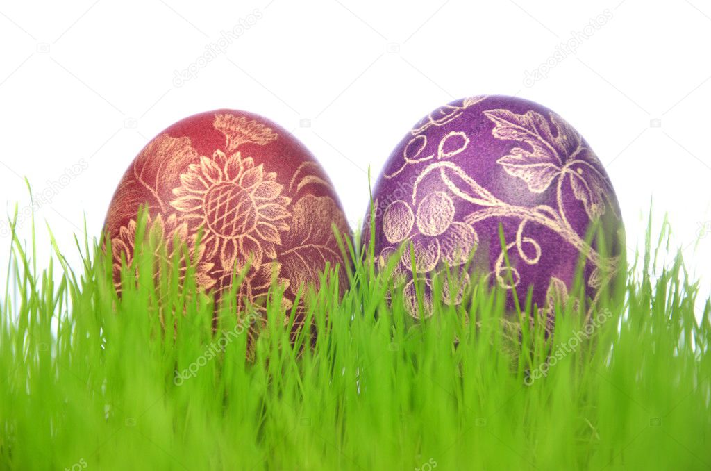 Two traditional scratched handmade Easter eggs in the grass