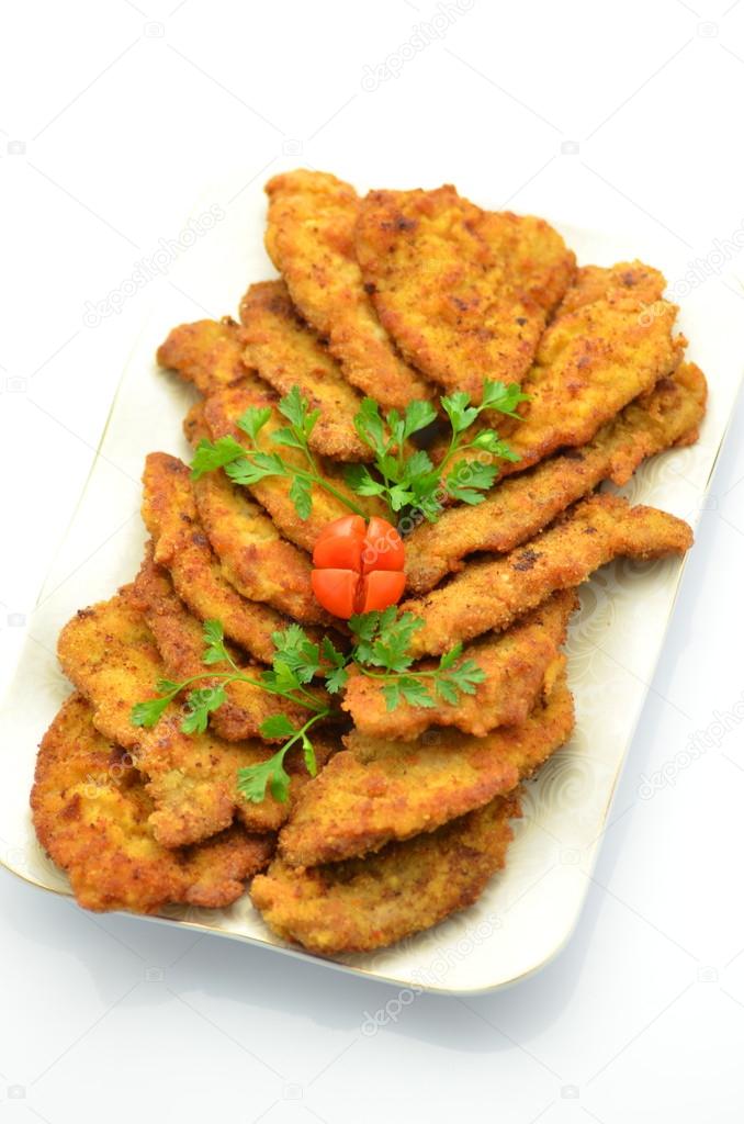 Breaded pork chops on a plate