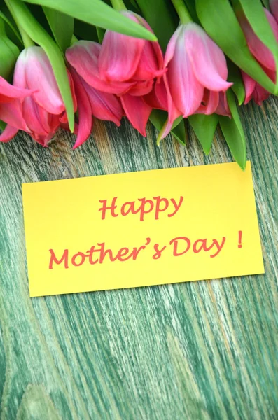 Happy mothers day and bouquet of gorgeous red tulips — Stock Photo, Image