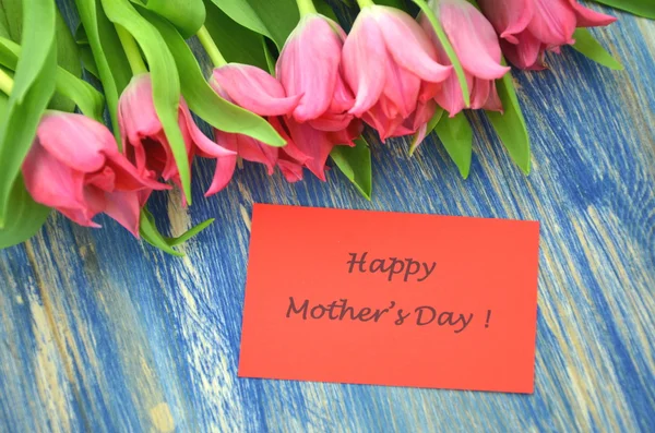 Happy mothers day and bouquet of gorgeous red tulips — Stock Photo, Image