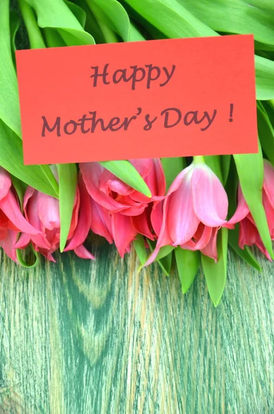 Happy mothers day and bouquet of gorgeous red tulips — Stock Photo, Image