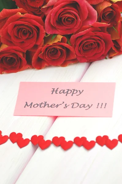 Happy mothers day and bouquet of gorgeous red roses — Stock Photo, Image