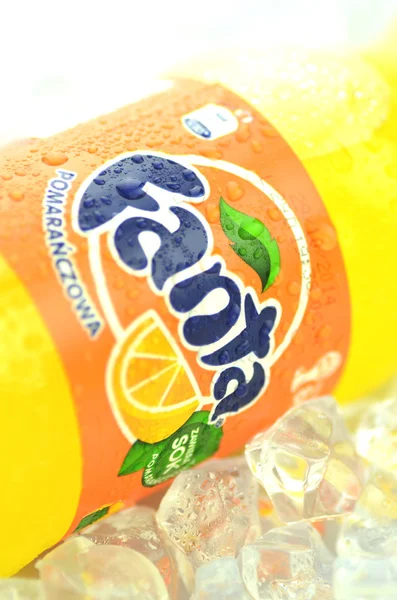 Bottle of Fanta drink on ice cubes — Stock Photo, Image