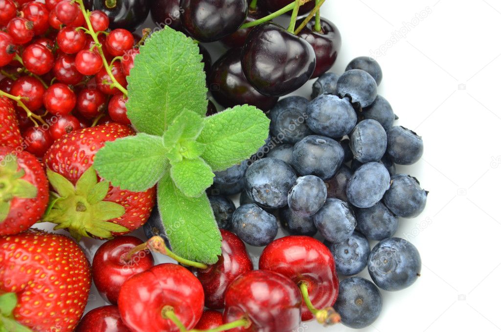 Variety of soft fruits, strawberries, raspberries, cherries, blueberries, currants isolated on white