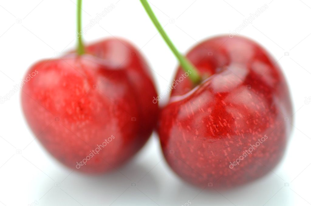 Closeup of ripe, fresh and sweet cherries isolated on white