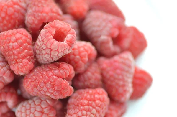 Closeup of ripe, fresh and sweet raspberries isolated on white — Stock Photo, Image