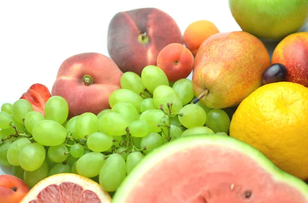 Variety of fresh and delicious fruits isolated on white — Stock Photo, Image