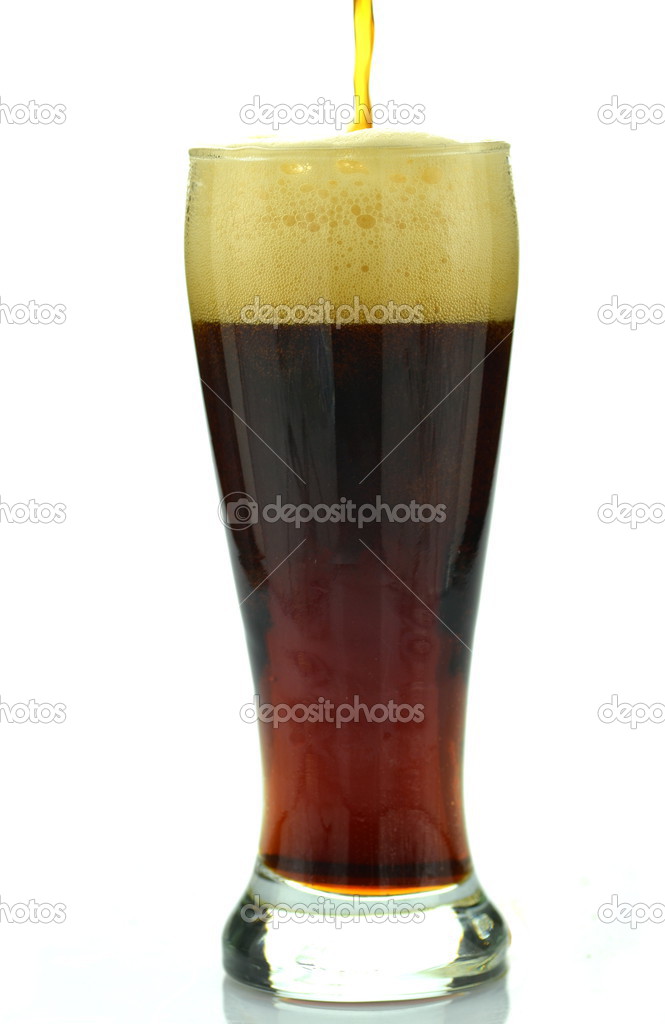 A glass of dark beer isolated on white
