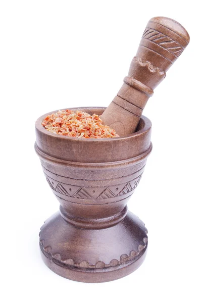 Dried carrot slices in a wooden mortar — Stock Photo, Image