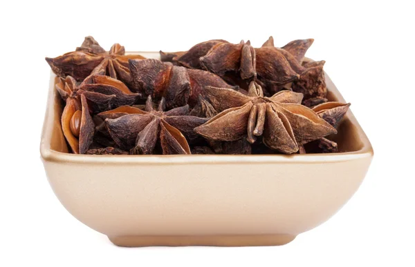 Anise stars in a golden bowl — Stock Photo, Image