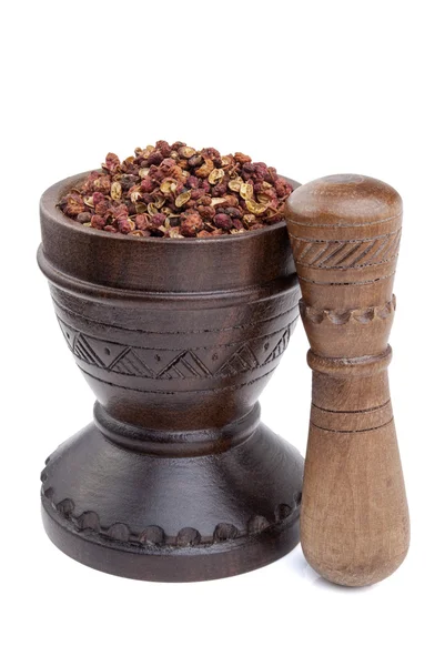 Wooden mortar full of Szechuan peppercorns — Stock Photo, Image