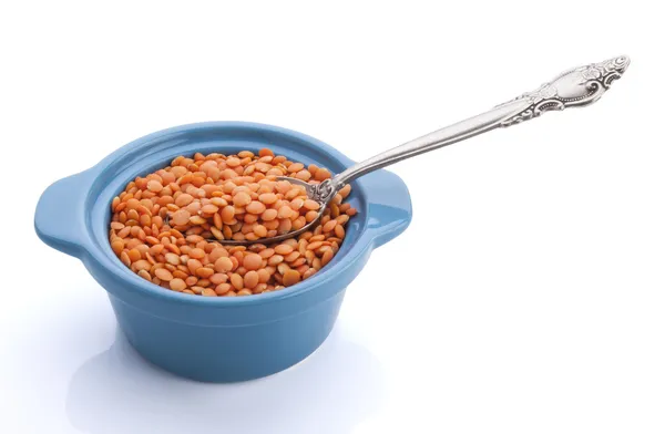 Bowl of red lentils isolated on white background — Stock Photo, Image