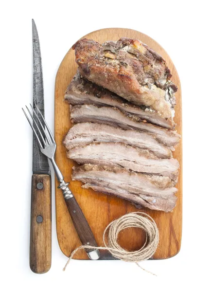 Roast of veal on old wooden board — Stock Photo, Image