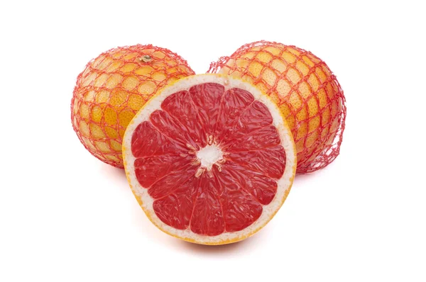 Net with fresh grapefruits on a white background — Stock Photo, Image