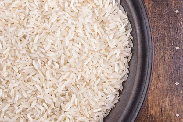 Plate of Rice on Dark Wood Background — Stock Photo, Image