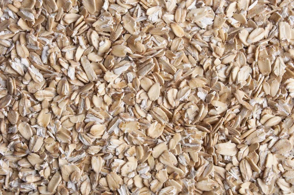 Oatmeal golden background close up — Stock Photo, Image