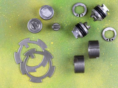 Car spare parts ,a wide range of goods and delivery to the conveyor of automobile production on a colored New Year's background.