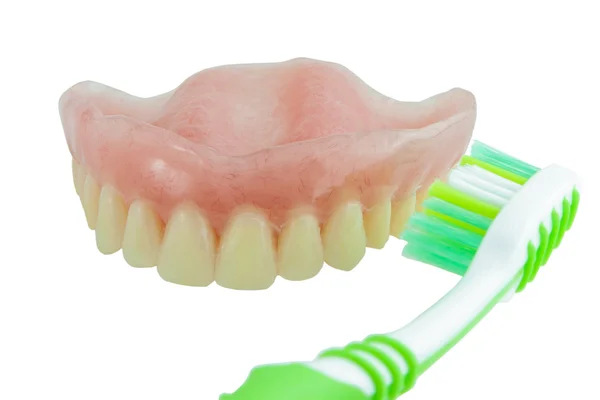 Protes med tandborste rengöring fläckar på tänderna — Stockfoto
