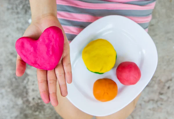 Creating Heart toys from play dough — Stock Photo, Image
