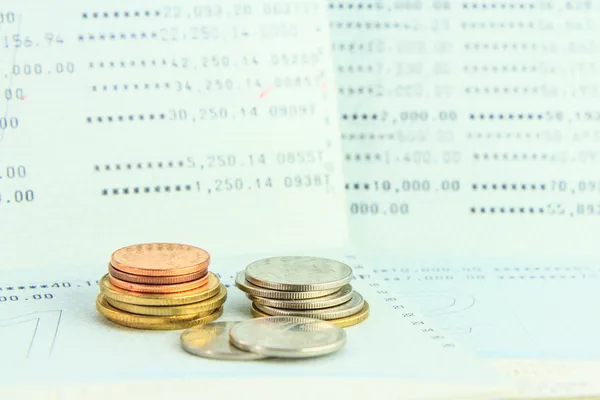 Coins on account passbook — Stock Photo, Image