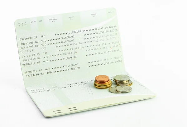 Coins on account passbook isolate — Stock Photo, Image