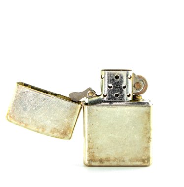 Vintage silver gasoline lighter isolated on white background clipart