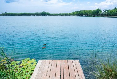 Wooden footbridge with views of Banyoles lake