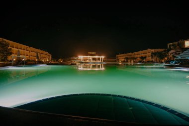 EGYPT. LUXOR - 10.10.2021. Night View Of Villa Resort With Swimming Pool. A beautiful pool illuminated at night