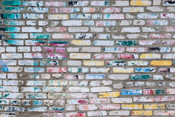 Colorful brick Background. Old Grungy Brick Wall Horizontal Texture. Brickwall Backdrop. Stonewall Wallpaper. Vintage Wall With Peeled Plaster. Retro Grunge Wall. Brick Wall With Uneven Stucco