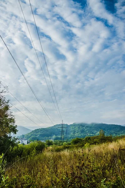 High Voltage Power Transmission Line Mountain Range Overhead Power Line — Stock fotografie