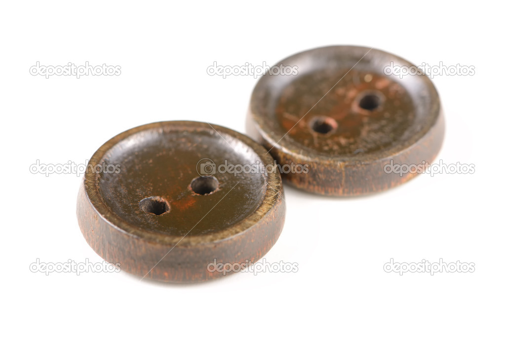 Old brown buttons isolated on white background