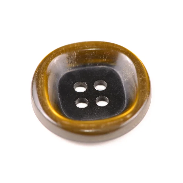 Стара коричнева кнопка ізольована на білому тлі — стокове фото