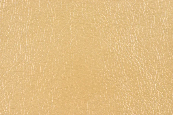 Textura de piel sintética brillante beige Fotos de stock libres de derechos