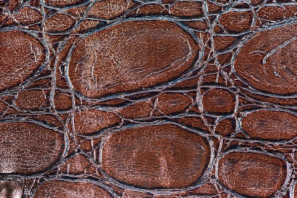 Brown synthetic leather with embossed texture — Stock Photo, Image