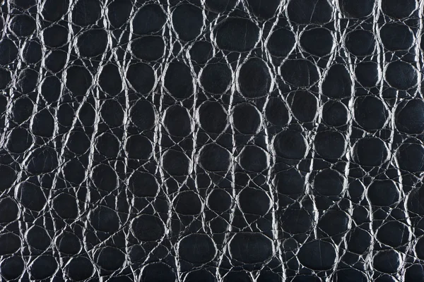 Black synthetic leather with embossed texture — Stock Photo, Image