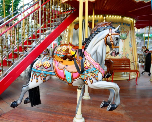 Children carousel running horses — Stock Photo, Image