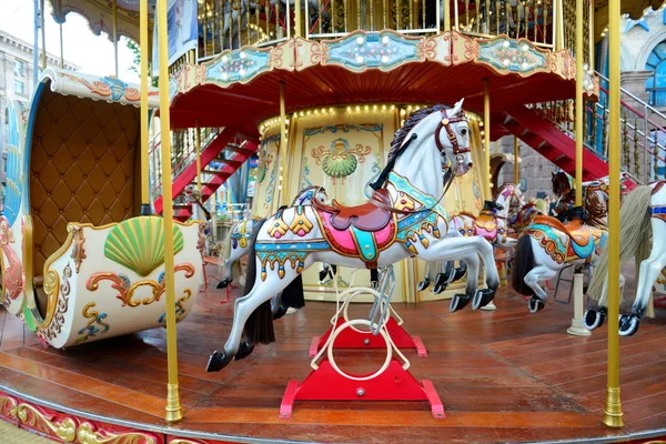 Children carousel running horses — Stock Photo, Image