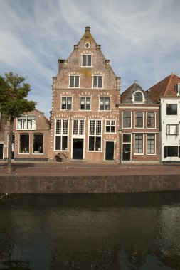 Old house on the harbor of Hoorn, Holland. clipart