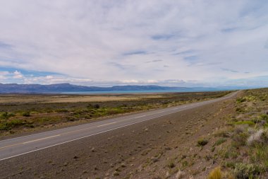 Lake Viedma with endless road in Argentina Patagonia clipart