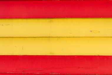 Wooden planks painted in spanish colours red yellow clipart