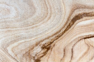 farklı satır yapıları ile kahverengi taş yüzeyi düz