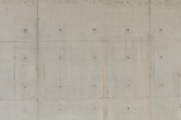 Large concrete wall with several holes for text — Stock Photo, Image