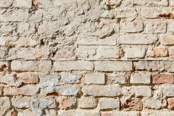 Verfomfaaide bakstenen muur in afgestoft geel detail — Stockfoto