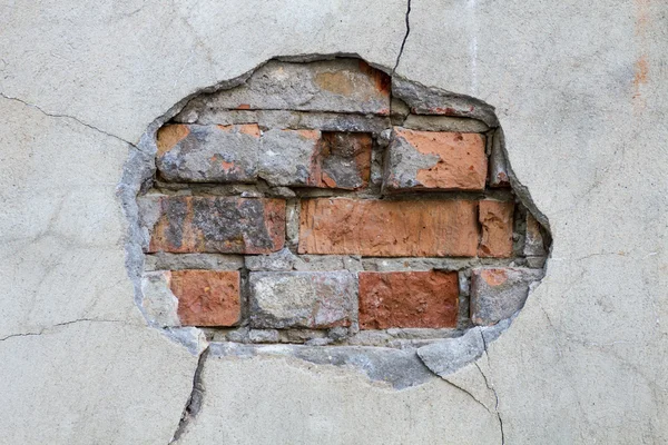 Hole in a wall red bricks looking out detail — Stock Photo, Image