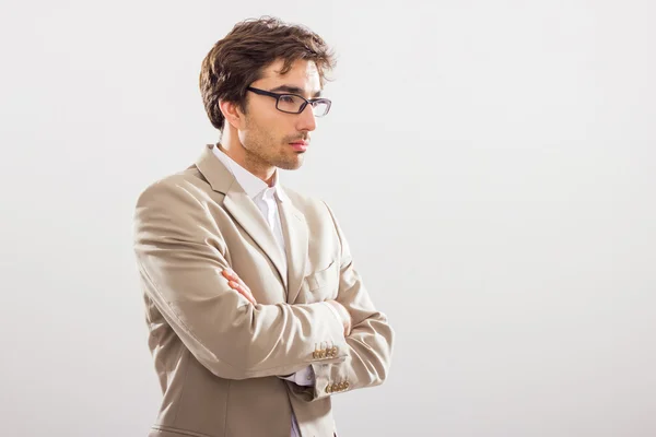 Businessman standing, looking off into distance — Stock Photo, Image