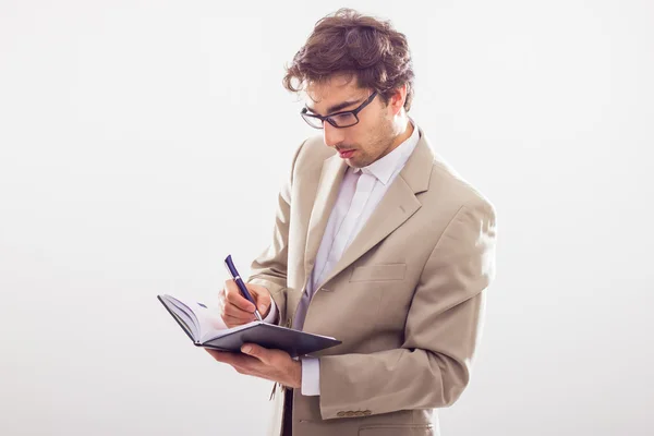 Geschäftsmann macht sich Notizen — Stockfoto