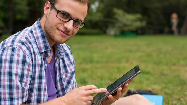 Student on grass — Stock Photo, Image