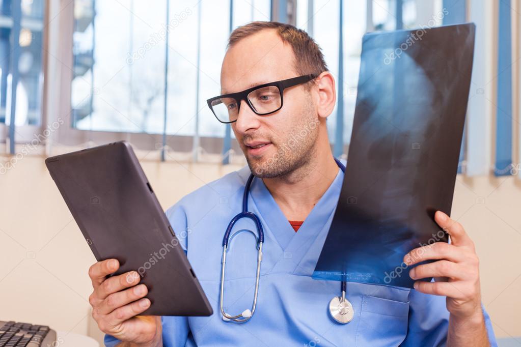 Doctor with tablet and x-ray picture